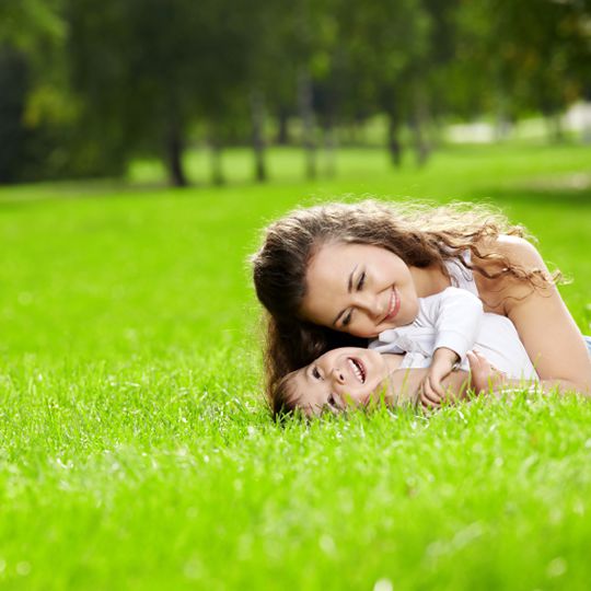 Mom and child on lawn